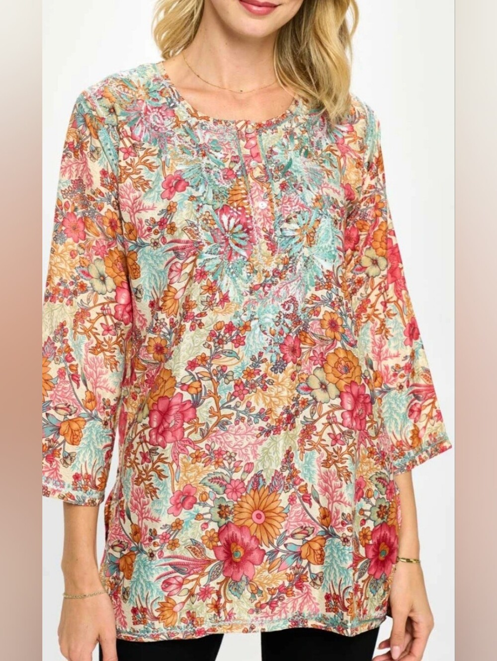 Dolma embroidered floral tunic is an artsy, bohemian-style top characterized by
